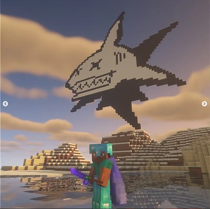 A shark built out of blocks floating above a desert in Minecraft.