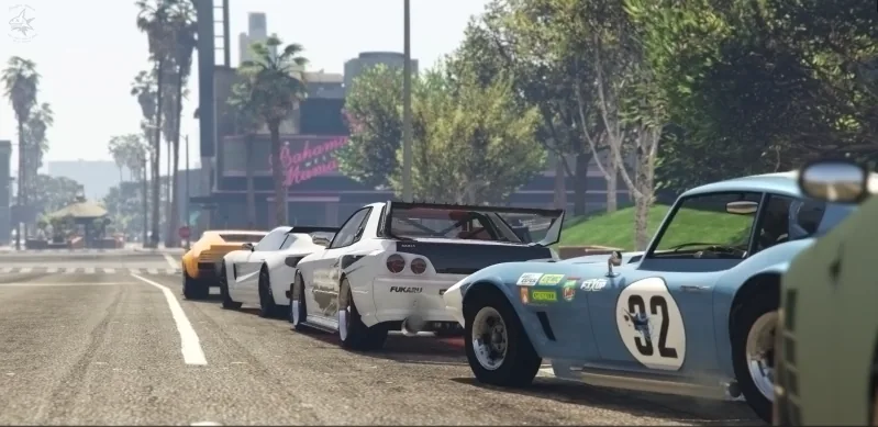 A line of tuned cars parked along a palm-lined street at a GTA V club meet.